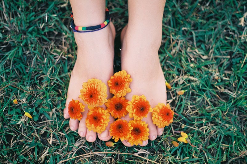 Feet covered with flowers